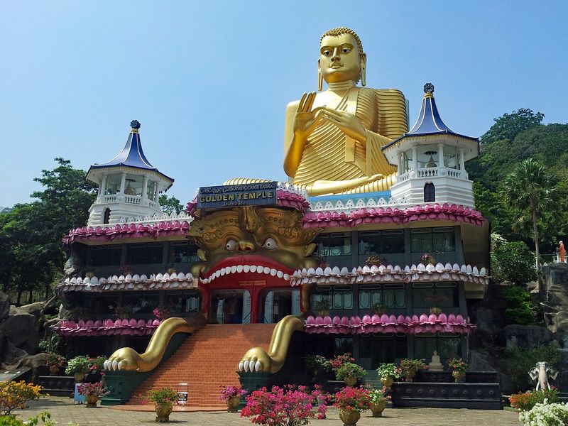 The Dambulla Cave Temple is an excellent addition to an itinerary of Sri Lanka's historical places. This image shows a golden Buddha on top of the Golden Temple.